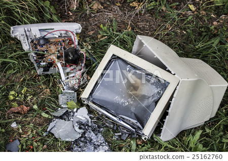 broken computer on the grass 25162760