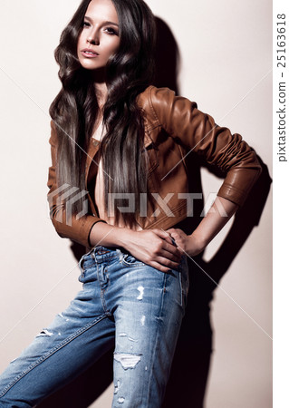 Attractive beautiful fashionable woman with curls Attractive beautiful fashionable woman with curls 25163618