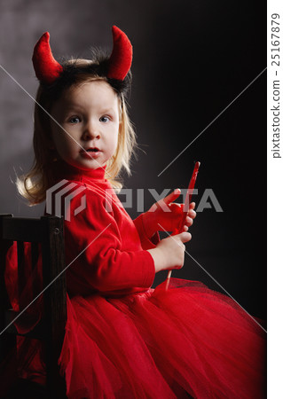 funny little devil on dark background 25167879