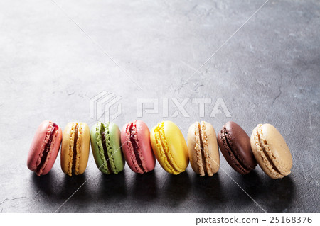 Colorful macaroons on stone table. Sweet macarons Colorful macaroons on stone table. Sweet macarons 25168376