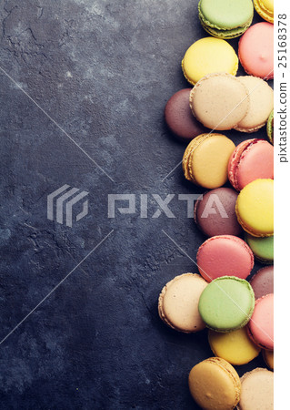 Colorful macaroons on stone table. Sweet macarons 25168378