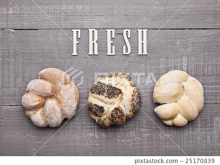 Fresh bread rolls for breakfast morning on wood Fresh bread rolls for breakfast morning on wood 25170839