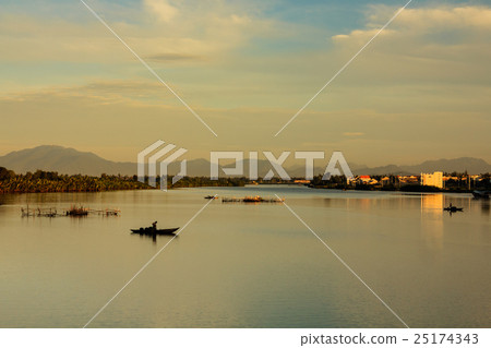 Fisherman is fishing in sunrise at Thu Bon river 25174343