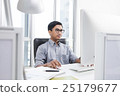 Businessman looking at computer screen in office 25179677