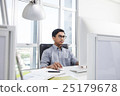 Businessman looking at computer screen in office 25179678