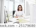 Smiling asian businesswoman working at office desk 25179680