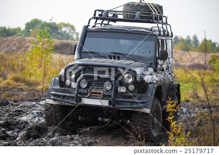 Russian off road car UAZ in mud 25179717