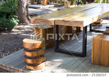 wooden table and stool in the garden 25180337
