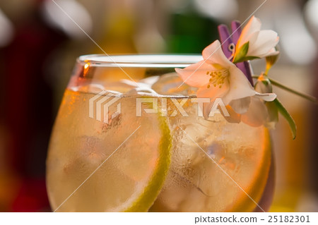 Slices of lemon in drink. 25182301