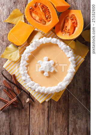 Tasty pumpkin cheesecake with whipped cream  25182600