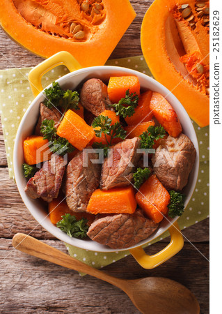 Braised beef with pumpkin closeup in the pan Braised beef with pumpkin closeup in the pan 25182629