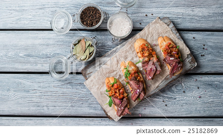 Small sandwiches with meat. Small sandwiches with meat. 25182869