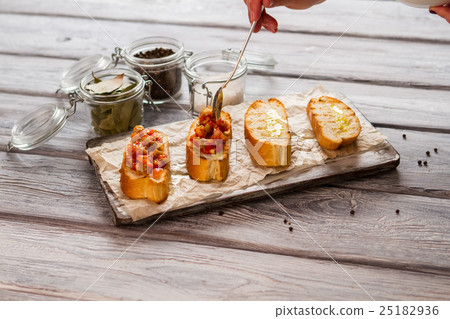Slices of bread with vegetables. 25182936