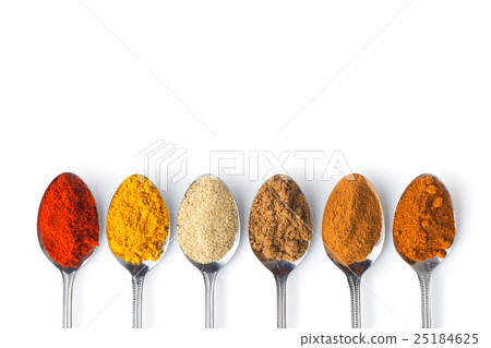 Various spices in spoons. 25184625