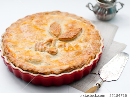 Cherry pie in a backing dish on a white background 25184716