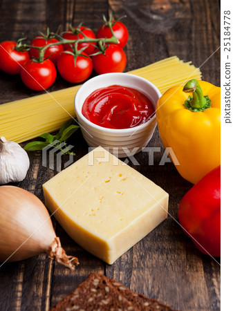 Raw food mix spaghetti tomatoes cheese and bread 25184778