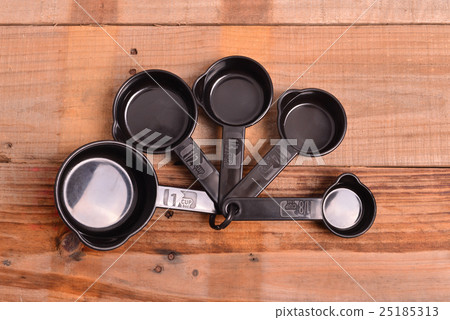 black measuring spoons in different sizes black measuring spoons in different sizes 25185313