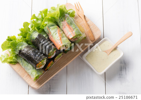 salad roll on white wood background 25186671