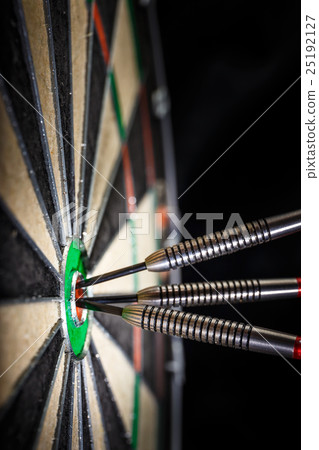 three darts in bull's eye, close up three darts in bull's eye, close up 25192127