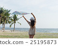 woman on the beach with scarf 25195873