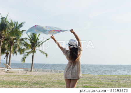 woman on the beach with scarf 25195873