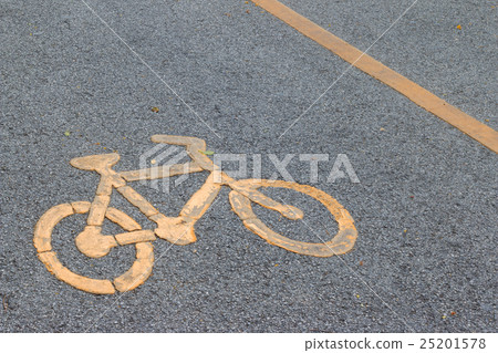 Yellow bicycle sign on asphalt bike lane. 25201578