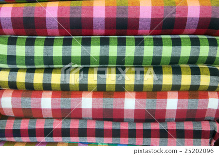 Traditional clothes are sold in shop in Myanmar. 25202096