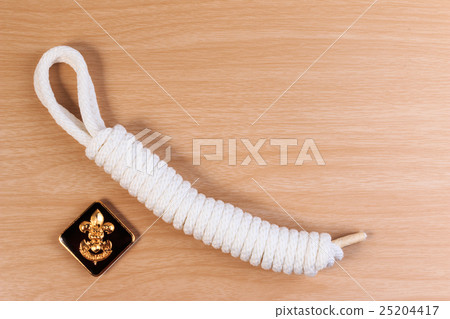 White scout rope with boy scouts symbol. 25204417