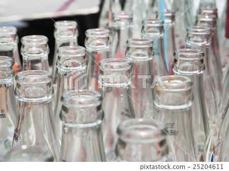 Close up detail of used glass bottles 25204611