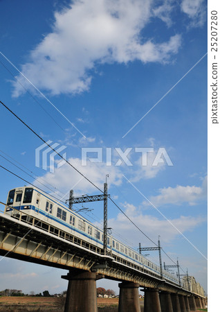 8000 series train of Tobu Noda line crossing the Edogawa bridge in winter season 8000 series train of Tobu Noda line crossing the Edogawa bridge in winter season 25207280