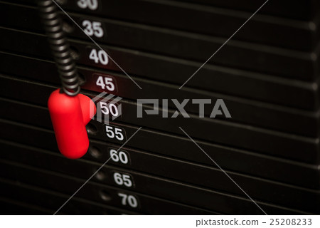 Close up of metal weight stack in a gym 25208233