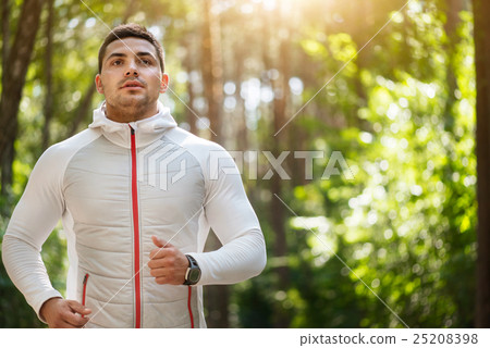 Good looking thoughtful sportsman running 25208398