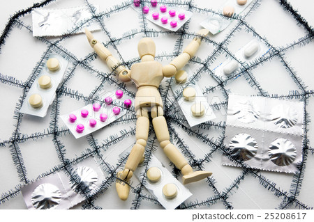 Doll and medicine caught in the spider web 25208617