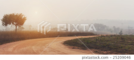 curve road in the valley with sunrise and mist 25209046