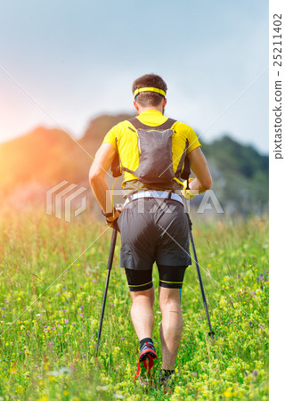 Nordic walking in the mountain meadows 25211402