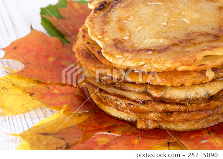pancakes with maple syrup on autumn leaves pancakes with maple syrup on autumn leaves 25215090