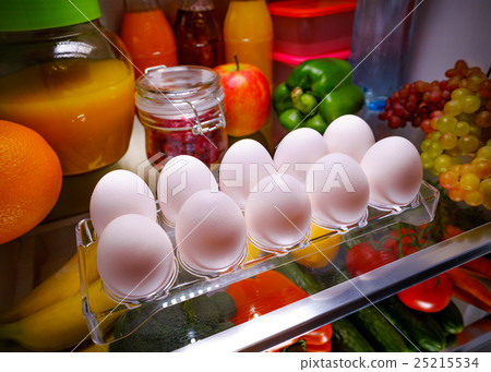 Chicken eggs on a shelf open refrigerator 25215534