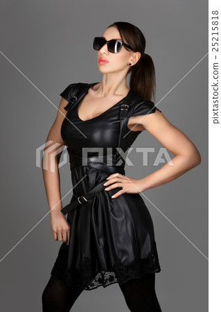 Beautiful girl in leather dress and sunglasses 25215818