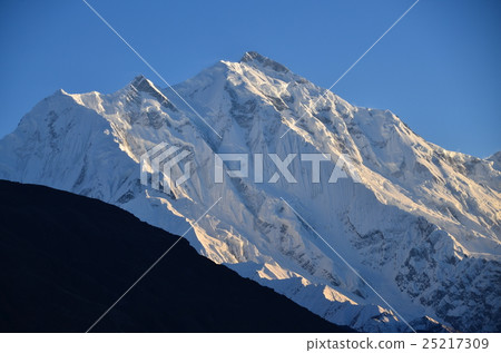 Mountains and villages seen from Hunzakalibabad at dusk of Pakistan The beautiful Rakaposhi peak 25217309