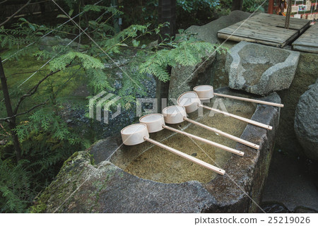 ladle on bamboo in japanese shrine 25219026