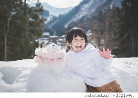 little boy with snowman 25219463