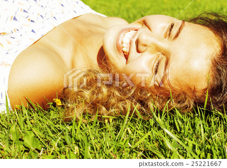 young cute summer girl on green grass outside young cute summer girl on green grass outside 25221667