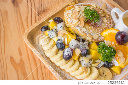 Pancake and fruit with ice cream on table . Pancake and fruit with ice cream on table . 25226681