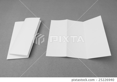 Trifold white template paper on gray background . Trifold white template paper on gray background . 25226940