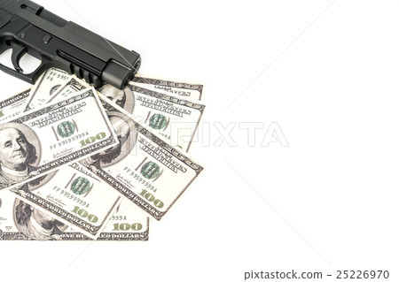 Close up image of pistol and dollar . 25226970