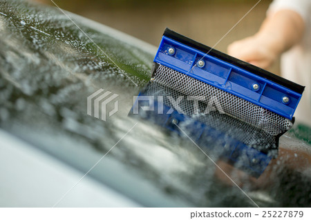 People cleaning car glass using cleaning brush 25227879