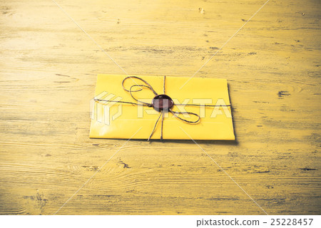 Letter with seal on table 25228457