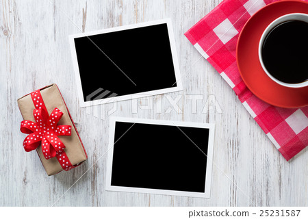 Blank photo frames on table Blank photo frames on table 25231587