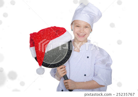 smiling girl, frying pan and Santa hat with snow 25235767