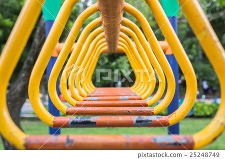 Old steel bar for trapeze. Outdoor exercise equipment at public park isolated on white background 25248749